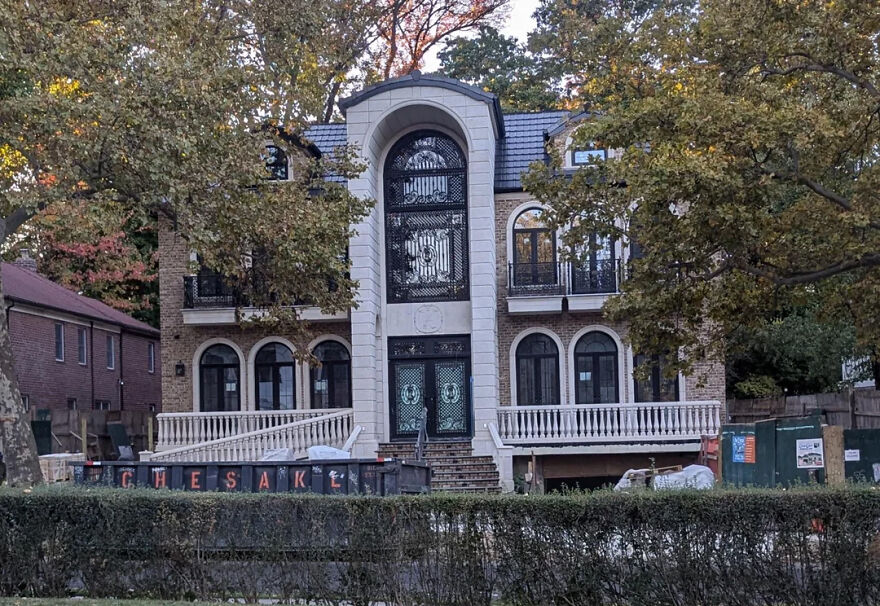 Large, ornate house with ironwork and balconies, surrounded by trees, symbolizing financial independence from a***e in marriage.