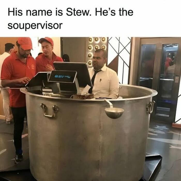 Man sitting inside giant cooking pot as a supervisor while two workers in red uniforms stand nearby food memes quick chuckles.