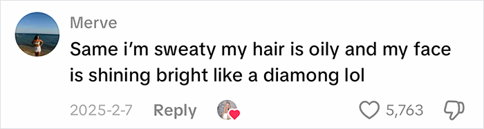 Screenshot of a social media comment where a user describes feeling oily and sweaty due to office air at work.