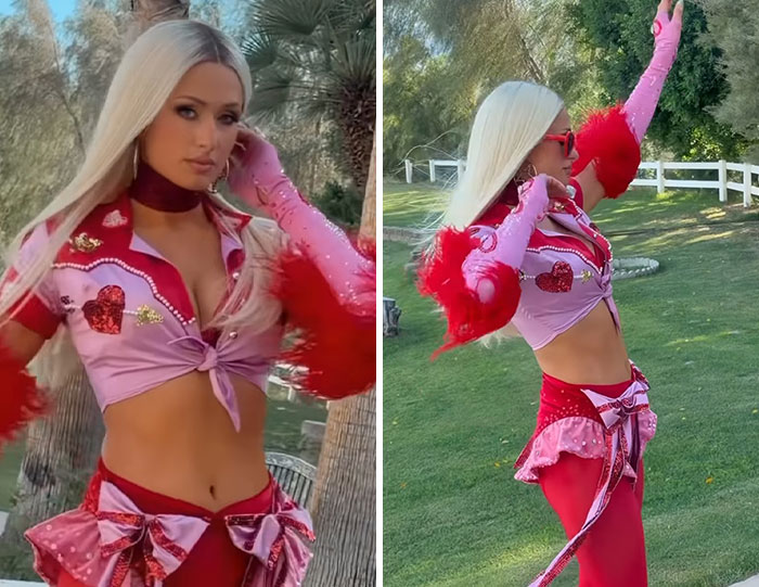 Woman in a vibrant pink and red outfit with feathered sleeves and heart details at Coachella 2026 fashion fails and absurd looks.