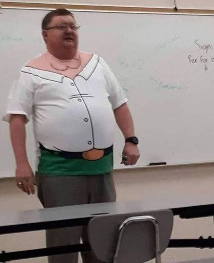 A man in a Peter Griffin costume shirt, looking bewildered, in front of a whiteboard. One of many weird images.