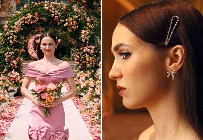 Euphoria's outfits: A woman in a pink off-the-shoulder gown holding flowers, standing on a flower-petal aisle.