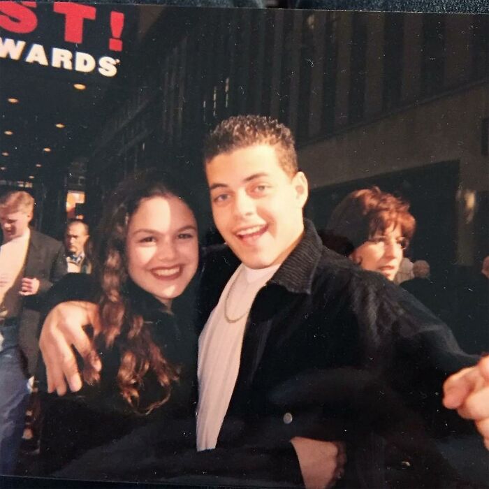 Young couple smiling outside at awards event
