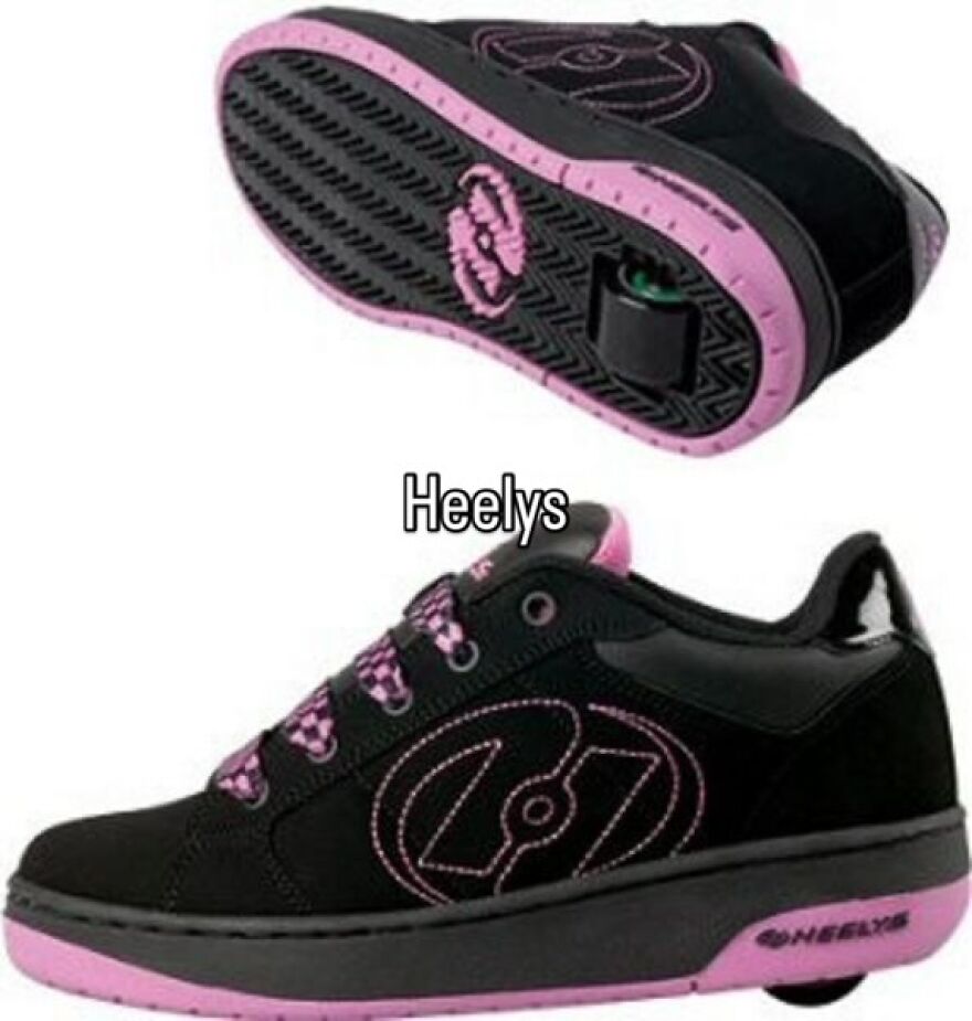 Nostalgic black and pink Heelys shoes, featuring a hidden wheel, embodying the vibe of growing up in the 2000s.