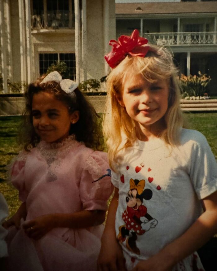 Two girls in vintage dresses and bows outdoors from celebrity friendships