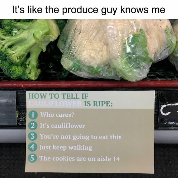 Produce section with broccoli and wrapped cauliflower, humorously showing a meme about telling if cauliflower is ripe.