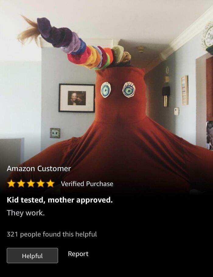 Person wearing a colorful scrunchie-covered horn and red fabric outfit with drawn-on eyes, related to eyeliner reviews.