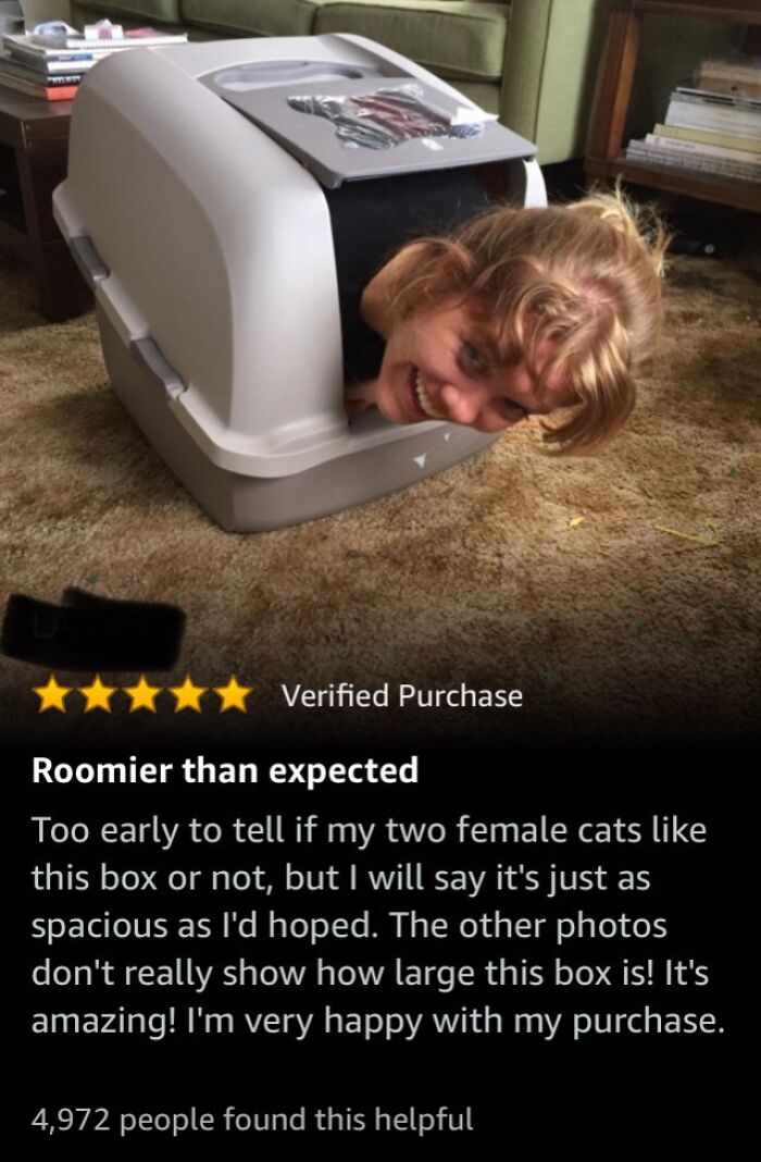 Person humorously inside a large cat box with a five-star review, highlighting roomy and spacious design.