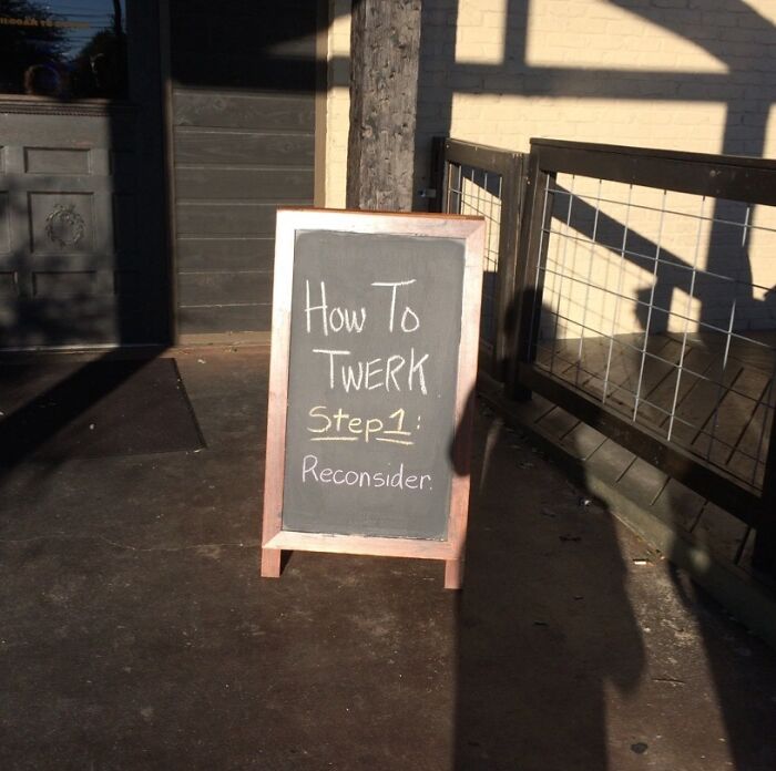 Chalkboard sign outside a building with funny advice about twerking: Step 1, Reconsider, capturing humorous pieces of advice.