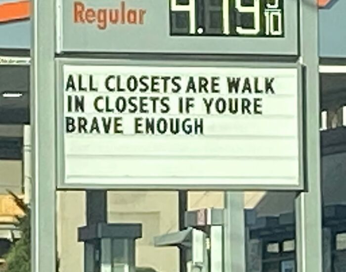 Gas station sign displaying funny pieces of advice about closets and bravery, highlighting humor and playful wisdom.