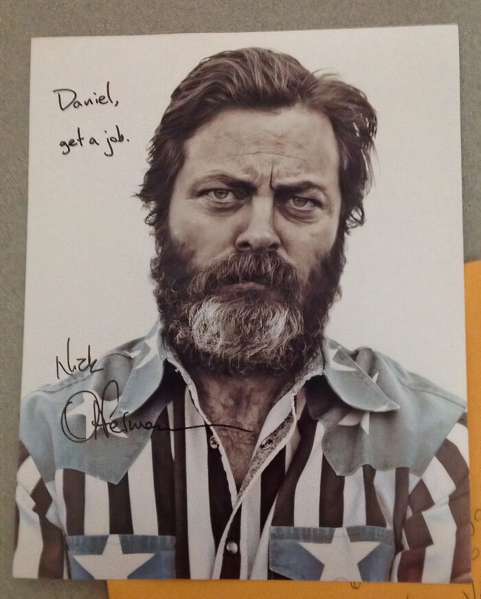 Portrait of a bearded man wearing a star-striped shirt with handwritten funny pieces of advice in black ink.
