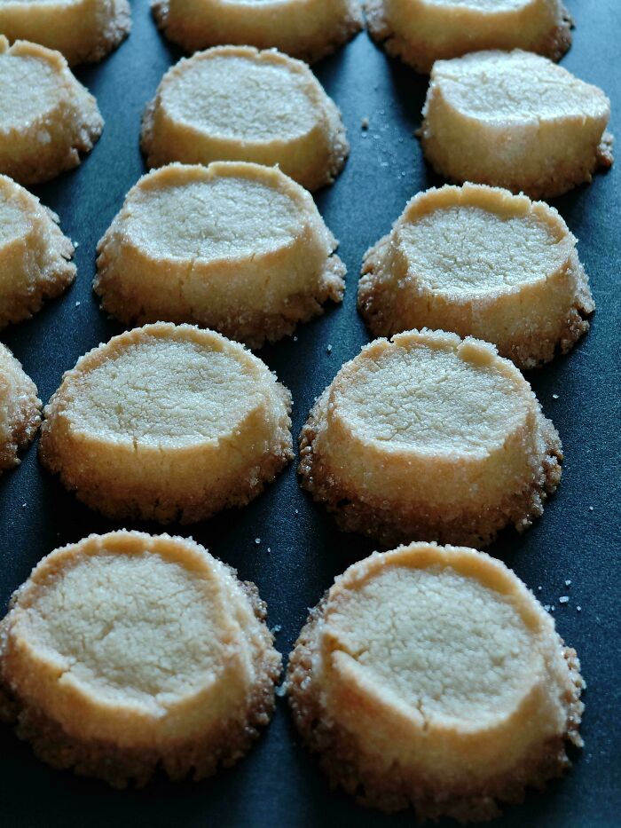 Close-up of baked cookies with uneven edges, illustrating times people saw the true colors of their friends online.