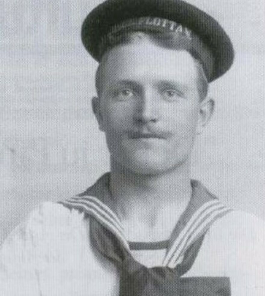 Vintage black and white portrait of a man in a sailor uniform, related to learning interesting and fun facts history.