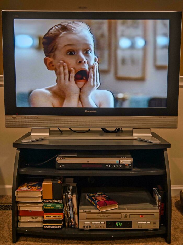 A classic home setup with a vintage TV playing a famous movie scene, highlighting nostalgia from the year you were born.