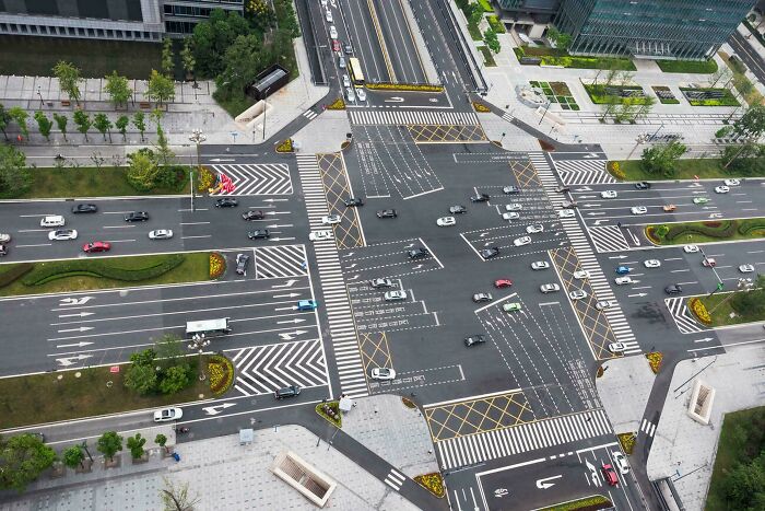 Aerial view of complex urban hell intersection with multiple lanes and sparse traffic