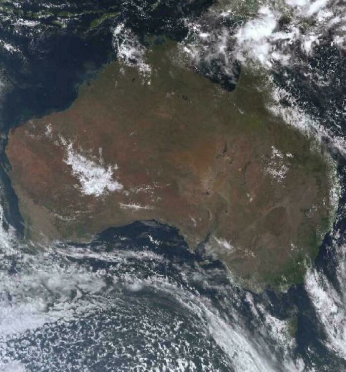 An aerial view of the Australian continent surrounded by clouds, an interesting image for an Aussie to see.