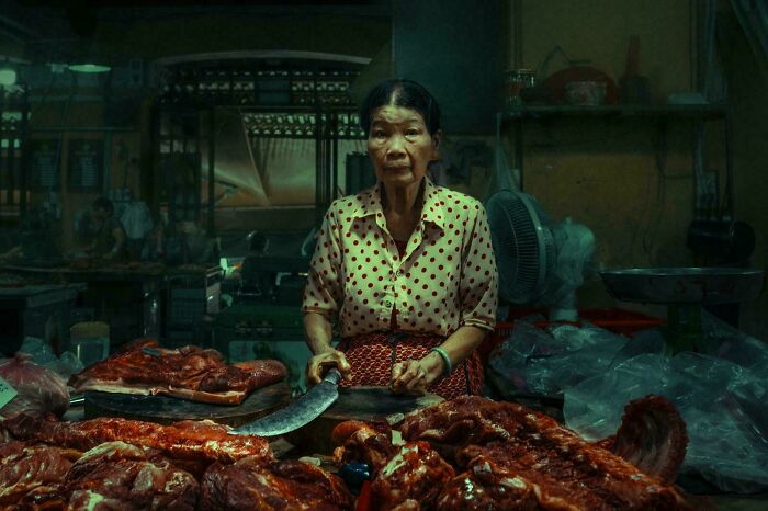 A meat vendor in a market, captured in an Accidental Renaissance style.