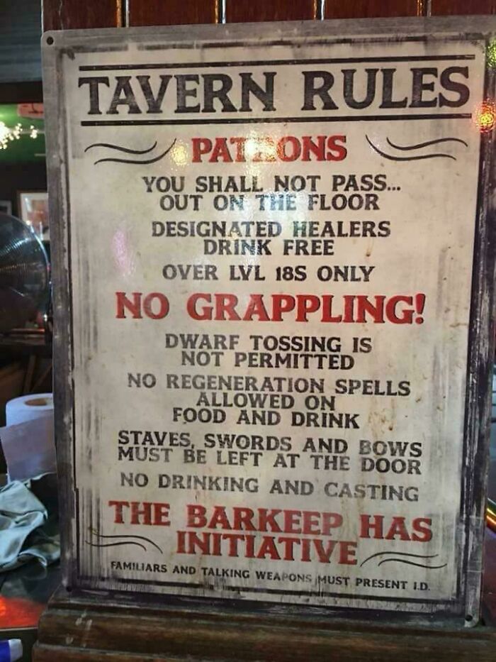 A worn sign with humorously specific tavern rules like No Grappling and Dwarf Tossing is not permitted. Underwear must be worn.