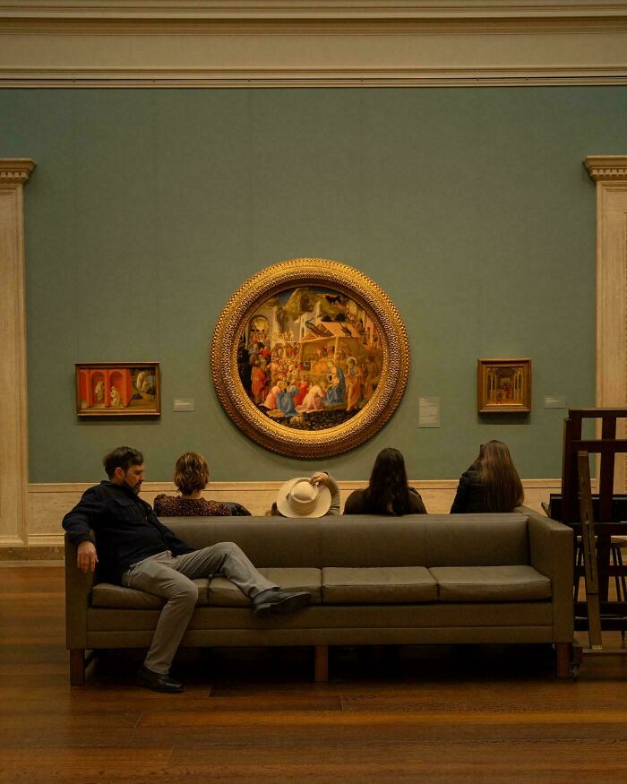 People on a couch in a museum looking like an Accidental Renaissance scene.