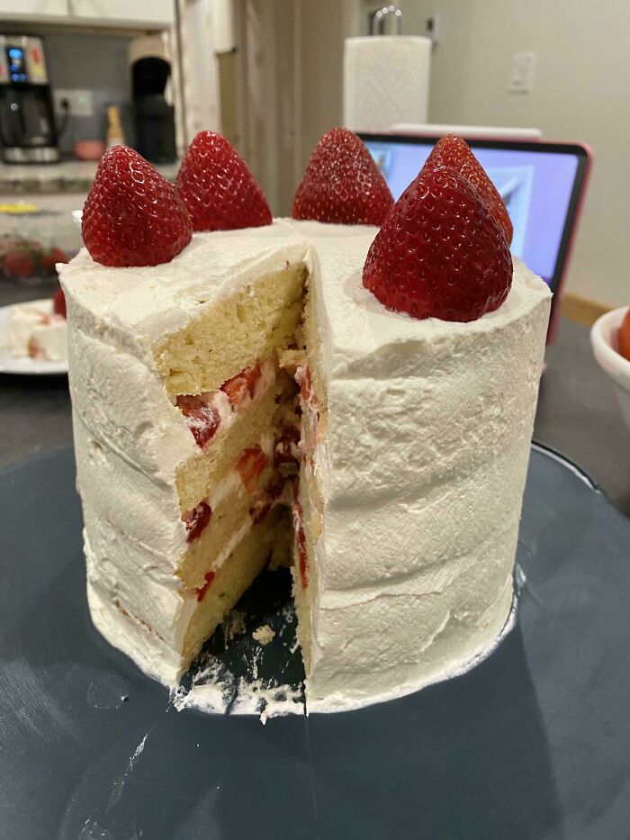 Strawberry shortcake with layers of cream and fresh strawberries