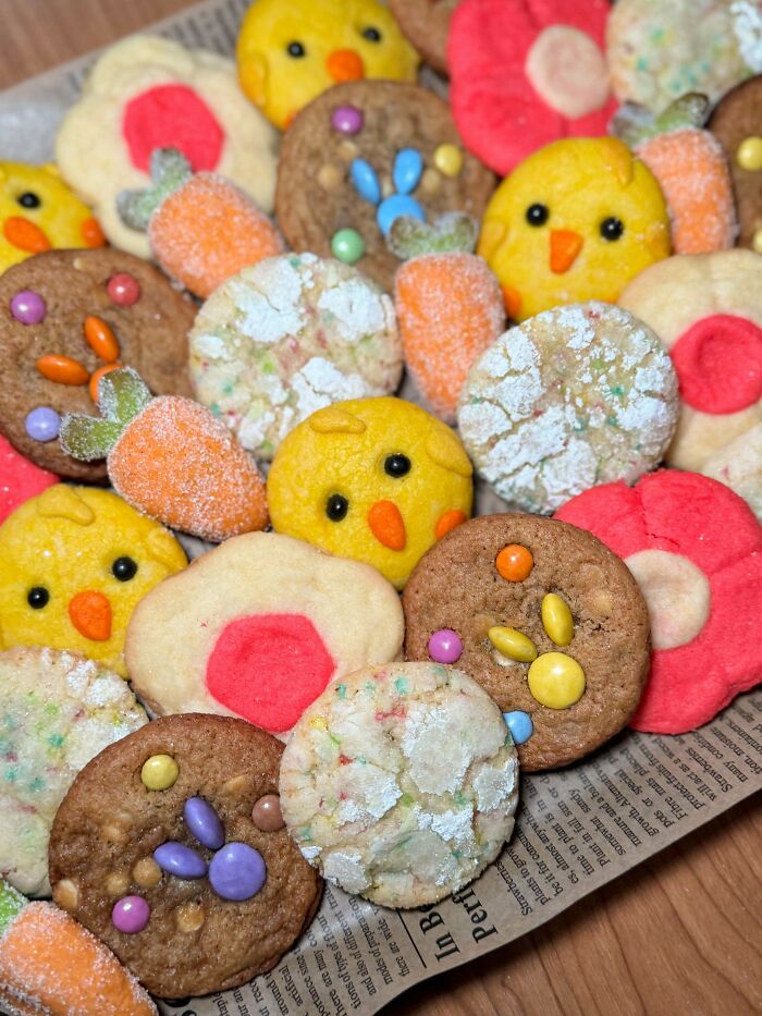 Colorful Easter-themed cookies shaped like chicks and carrots