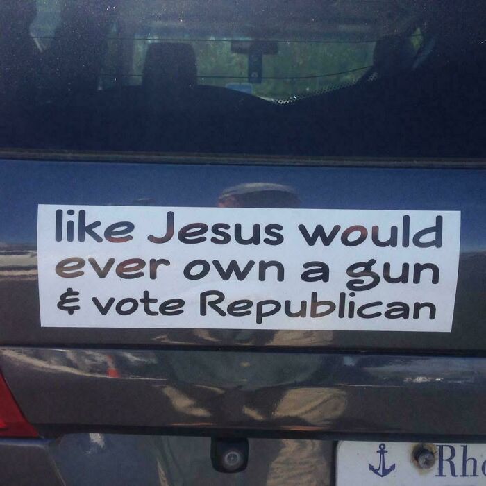 A funny, wild, and unfiltered bumper sticker on a dark car reading: like Jesus would ever own a gun & vote Republican.