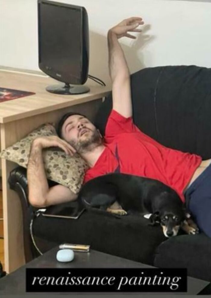 Man sleeping unhinged on a couch with an arm raised, accompanied by a small dog resting beside him.