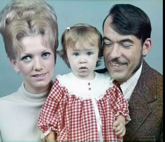 A family photo with parents showcasing bad hair mistakes; the mother has a large bouffant and father a comb-over.