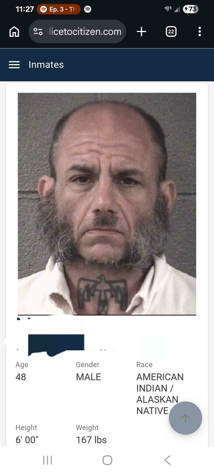A mugshot of a man with long sideburns and a partially bald head, a bad hair mistake.