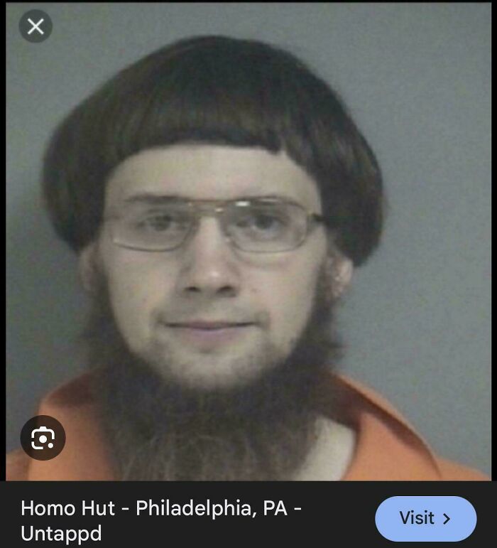 A mugshot of a man with a very short bowl cut hairstyle and a long, scraggly beard. This picture highlights bad hair mistakes.