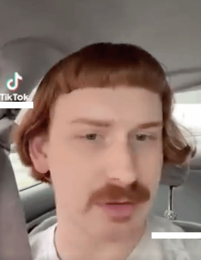 A man with a ginger mustache and a very short, bowl-cut hairstyle, illustrating a bad hair mistake.