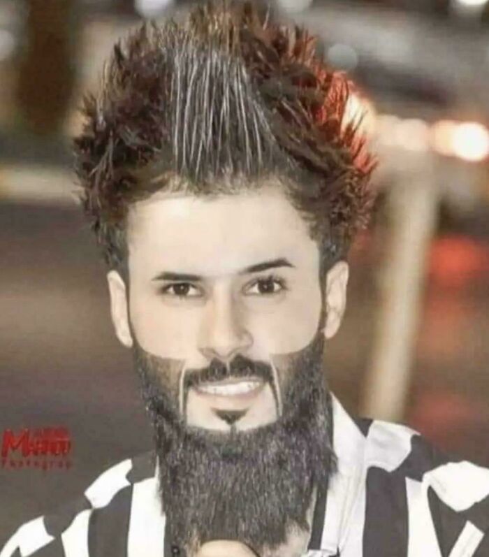 A man with a spiky, gravity-defying haircut and a geometric beard, an example of bad hair mistakes.