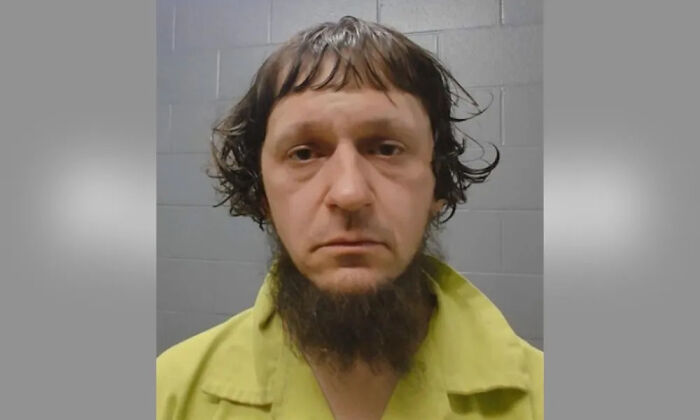 A mugshot of a man with disheveled hair and a long, scraggly beard, representing a bad hair mistake.