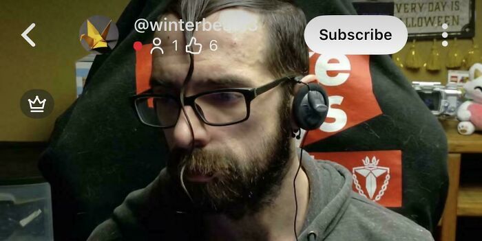 Man with a hilariously bad hair mistake, showing a long strand of hair hanging down over his face and beard.
