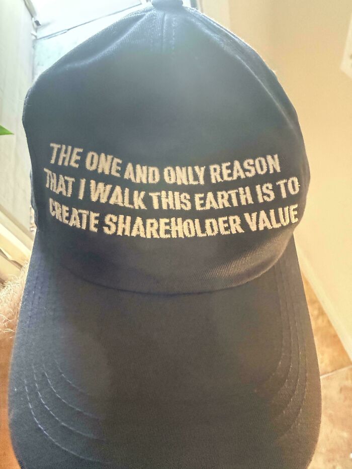 A black cap with text about shareholder value, popular in homedepot employees posts.