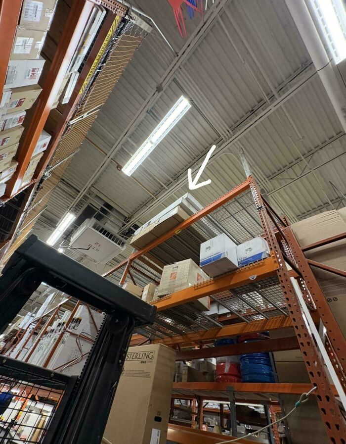 High shelving inside a Home Depot warehouse with boxed products stored near the ceiling