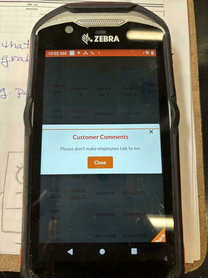 A zebra mobile device displaying a Home Depot customer feedback comment