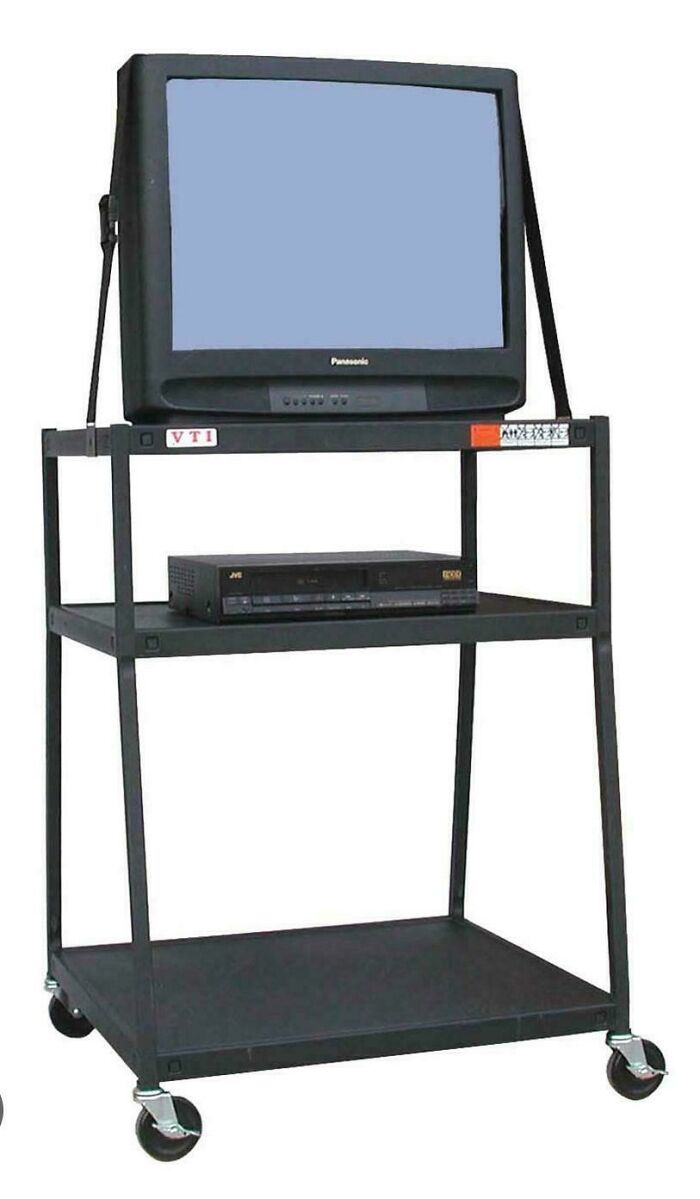 A classic 90s TV and VCR setup on a cart, bringing back nostalgic memes and childhood memories for 90s kids.