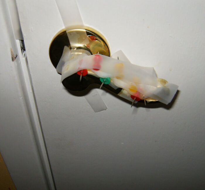 A door handle taped with tacks, a dumb and funny prank by a kid.