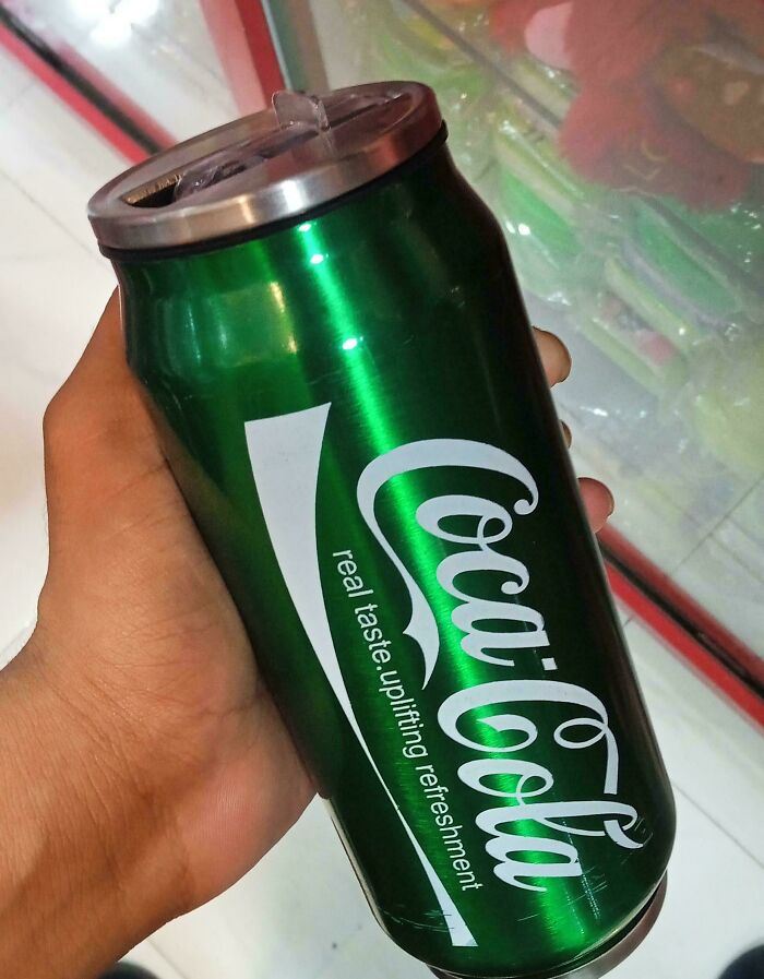 A baffling image of a green Coca-Cola can, a surprising color that sparks questions from viewers.