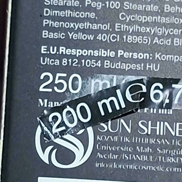 Cosmetic bottle showing a misleading volume label with 200 ml sticker covering original 250 ml