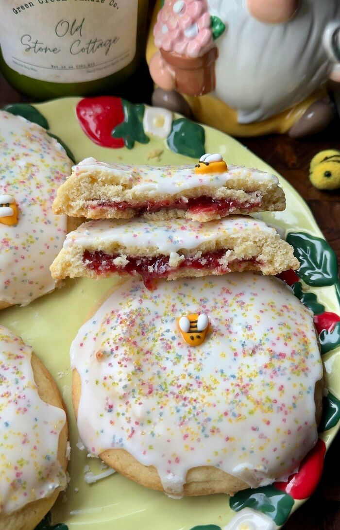 Frosted cookies with colorful sprinkles and bee decorations dessert close-up