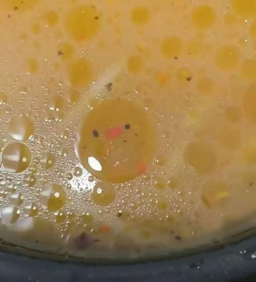 Close-up of food bubbles showing pareidolia with a face-like pattern in the liquid, highlighting pareidolia in everyday scenes.
