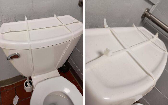Toilet cistern secured with zip ties in a bathroom, showing a gut warning about something wrong with the fixture.