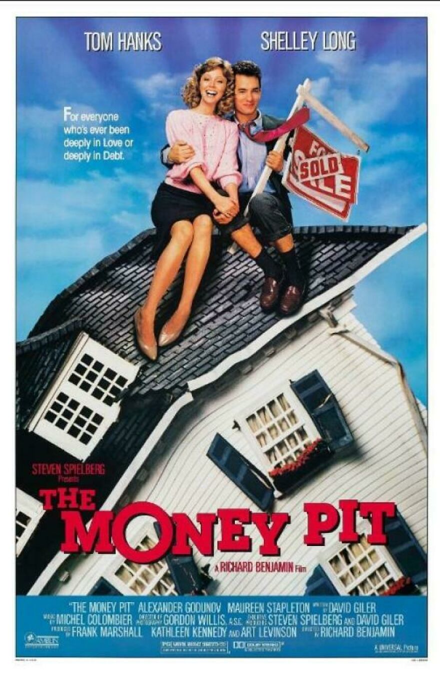 Couple sitting on roof holding sold sign, representing 80s homes and lifestyles shown in nostalgic posts about the 80s.