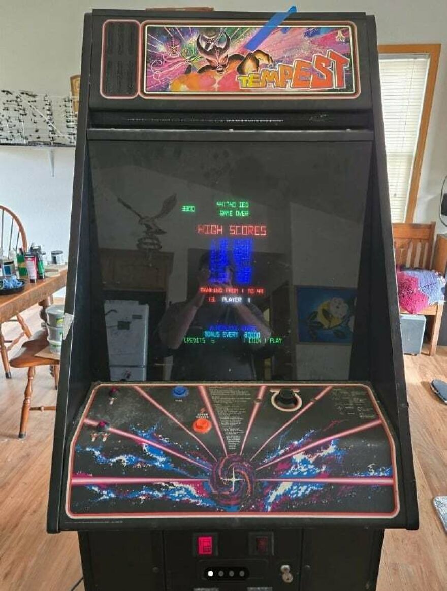 Vintage arcade game machine showing high scores, representing 80s nostalgia and parts of our lives that don’t exist anymore.