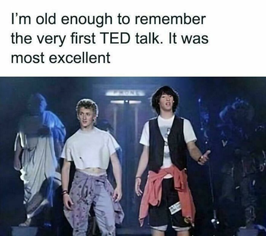 Two young men in 80s fashion with cropped shirts and vests on stage, reflecting on 80s moments from past lives.