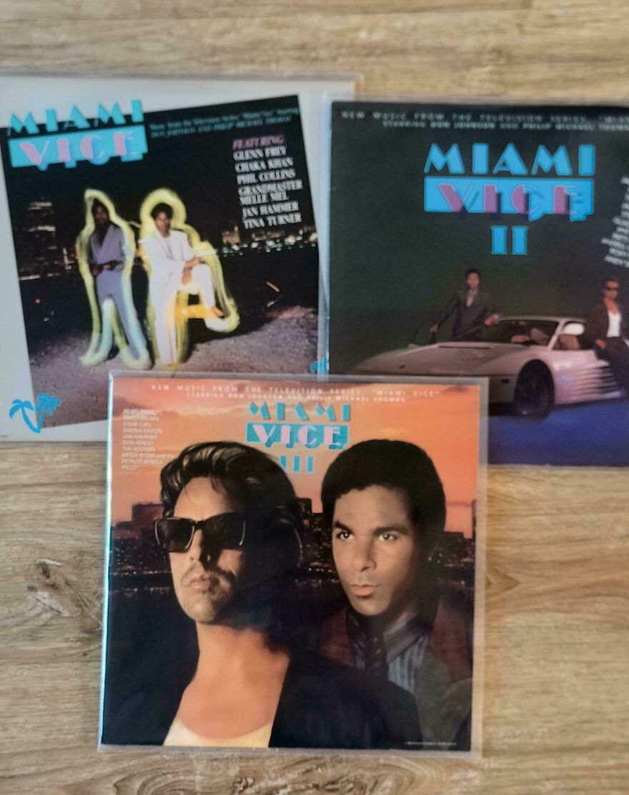 Three Miami Vice vinyl album covers from the 80s showing iconic music and visuals of that era.