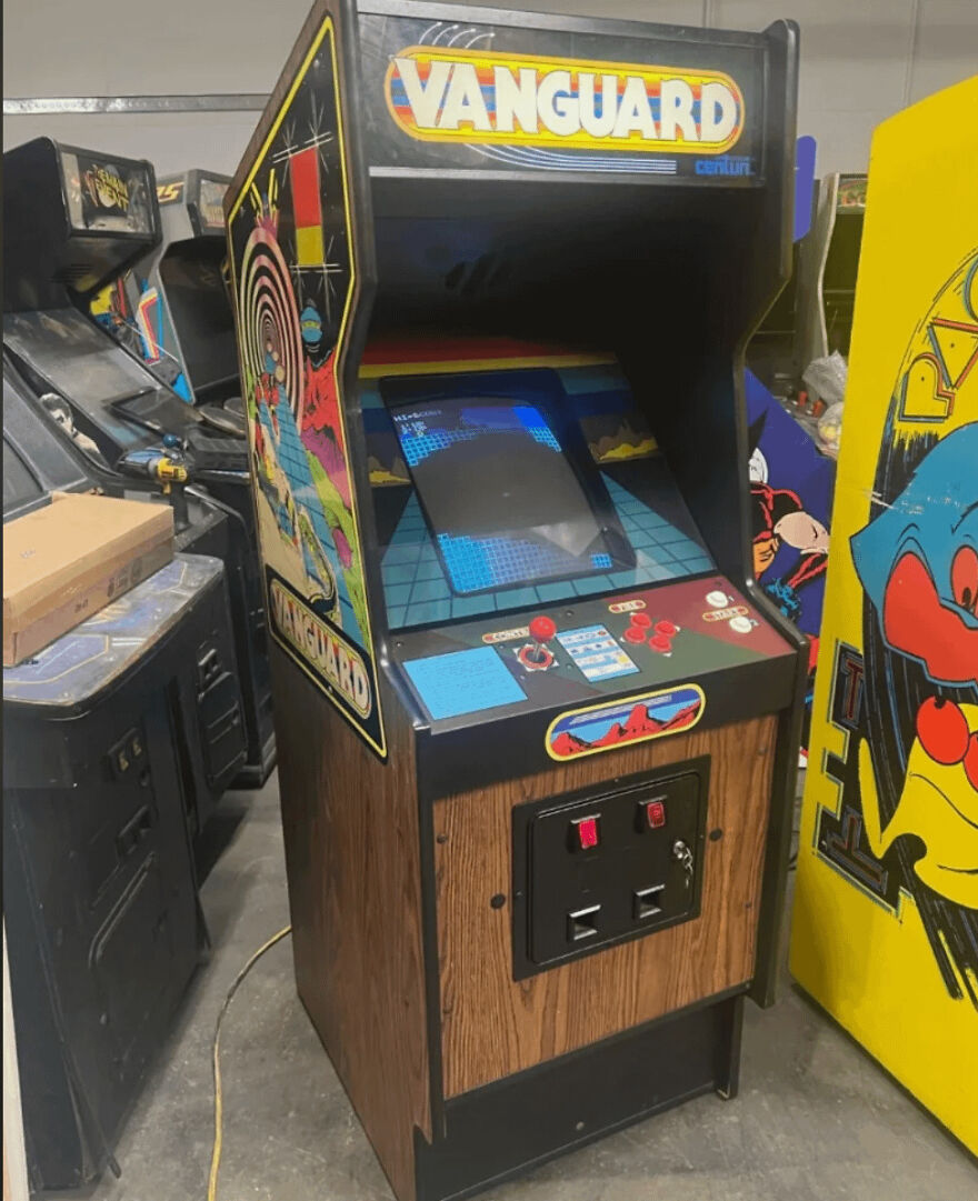 Vintage 80s arcade game cabinet Vanguard with colorful side art, showcasing a nostalgic part of life that no longer exists today.
