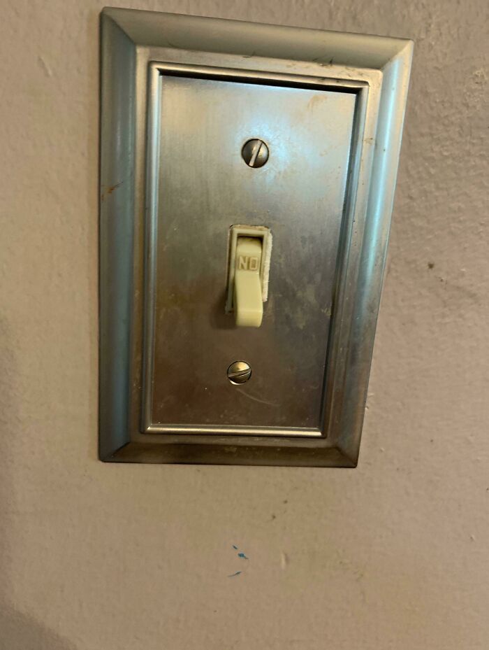 An upside-down light switch with ON at the bottom, showcasing a weird everyday thing. Might make you want to fix it.